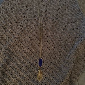 Kendra Scott necklace with blue stone and tassels